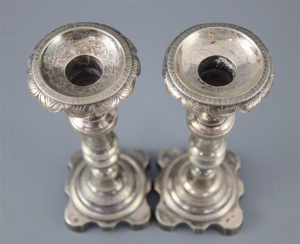 Two 19th century Brazilian? cast silver candlesticks,